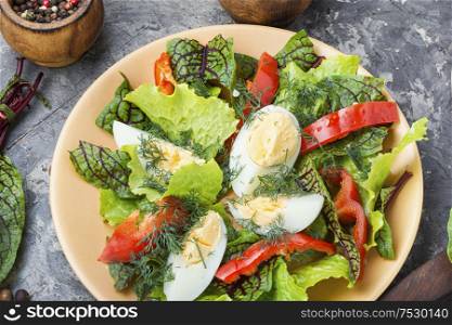 Spring diet salad with greens and egg.Salad with egg,sorrel and pepper. Vegetable salad with egg