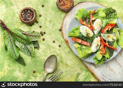 Spring diet salad with greens and egg.Summer salad. Vegetable salad with egg