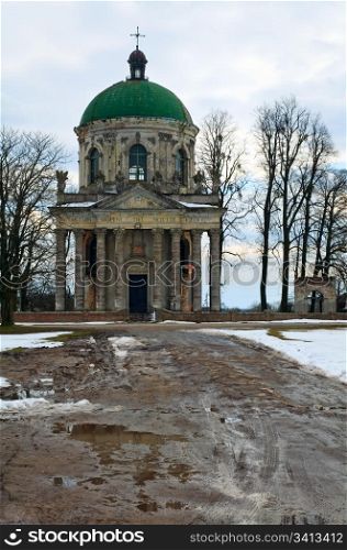 Spring evening view of old Pidhirtsi Roman Catholic church(Ukraine, Lvivska Region, built in 1752-1766 by order of Waclaw Rzewuski)