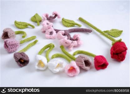 Spring flower for springtime, colorful handmade tulip on white background, diy product by knit can make gift for woman day or mother day