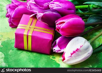 Spring flowers and gift box. Bouquet of purple Tulips and gift box.Postcard for Valentine Day