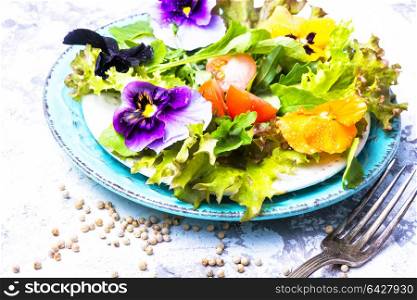 Spring flowers salad. Spring salad with edible flowers and herbs.Clean food.Detox.