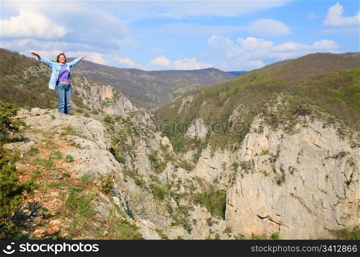 Spring Great Crimean Canyon mountain landscape and woman on top (Ukraine).