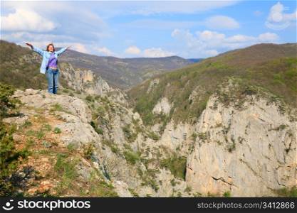 Spring Great Crimean Canyon mountain landscape and woman on top (Ukraine).