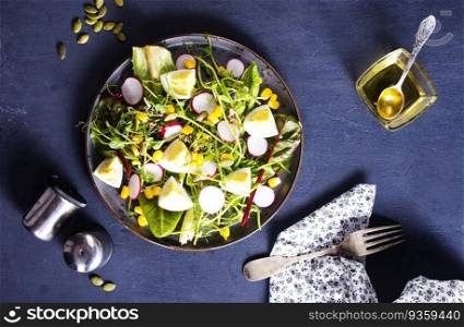 Spring green salad with egg, radish and onion