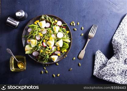 Spring green salad with egg, radish and onion