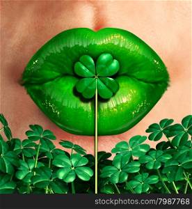 Spring kiss as emerald green lips kissing a four leaf shamrock clover as a st.patrick&rsquo;s day good luck charm celebration symbol.