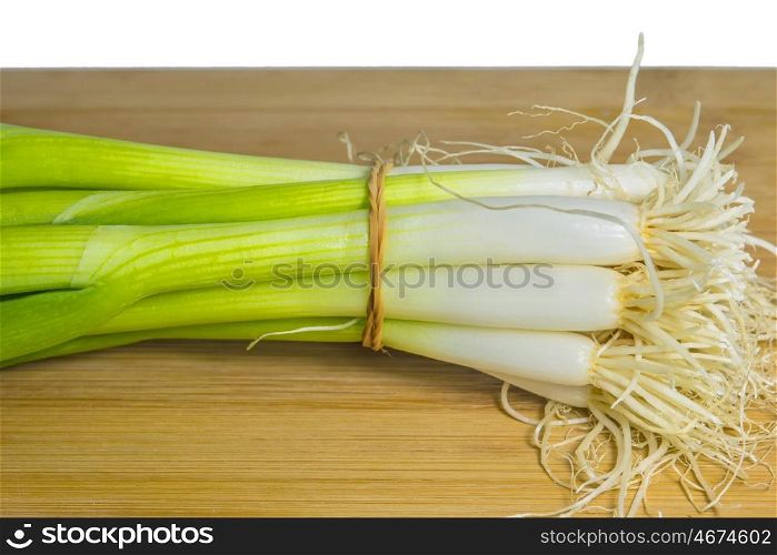 spring onion on a plank