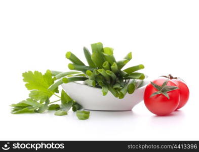 Spring onions and cherry tomato in bowl isolated on white background cutout