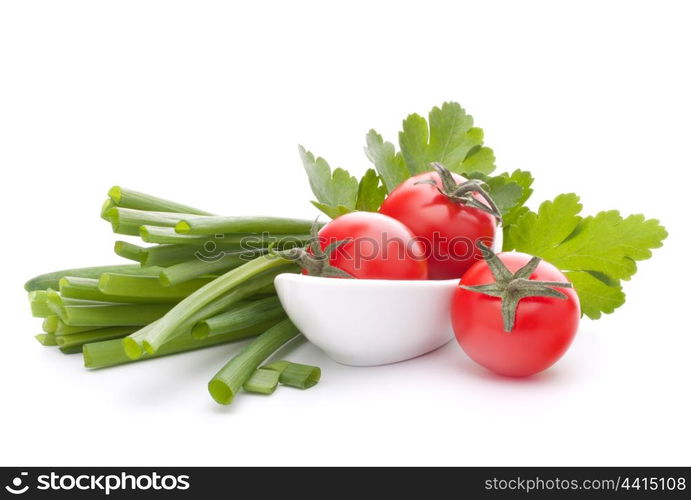 Spring onions and cherry tomato in bowl isolated on white background cutout