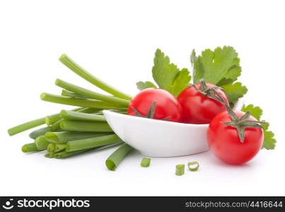 Spring onions and cherry tomato in bowl isolated on white background cutout