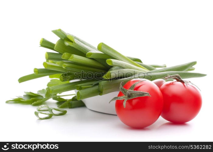 Spring onions and cherry tomato in bowl isolated on white background cutout