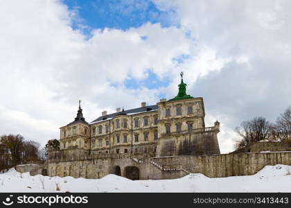 Spring panorama view of old Pidhirtsi Castle (Ukraine, Lvivska Region, built in 1635-1640 by order of Polish Hetman Stanislaw Koniecpolski). Five shots stitch image.