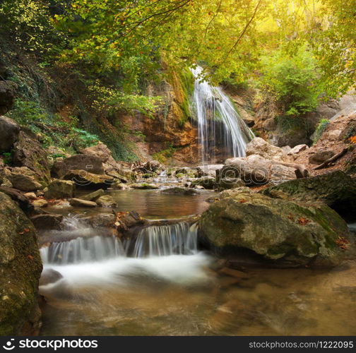 Spring rill flow. Nature waterfall composition.