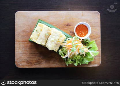 Spring roll on wood background