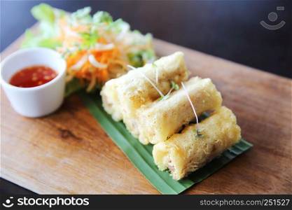 Spring roll on wood background