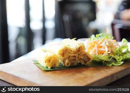 Spring roll on wood background