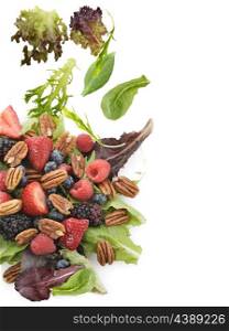 Spring Salad With Berries And Peanuts On White Background