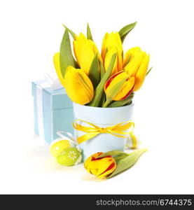 spring tulips with easter eggs on white background