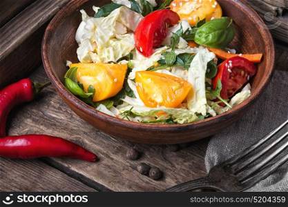 spring vegetable salad. Healthy eating.Salad with cabbage, tomato and lettuce