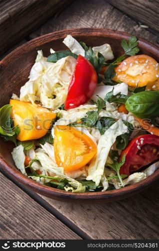 spring vegetable salad. Salad with fresh cabbage, tomato and lettuce