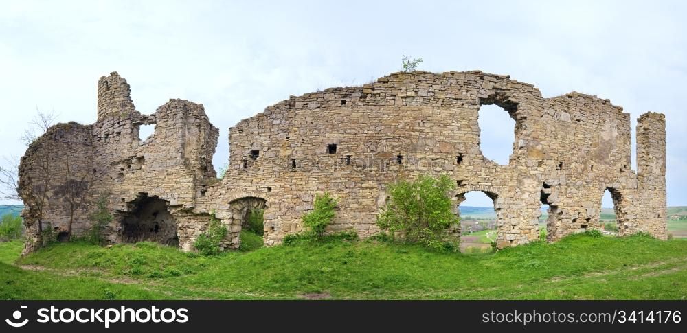Spring view of Chernokozinetsky castle ruins (Chernokozintsy village , Kamyanets-Podilsky region, Khmelnytsky Oblast, Ukraine). Built in second half of XIV th century. Two shots stitch image.