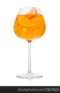 Spritz summer cocktail with ice and orange slice in wine glass on white background.