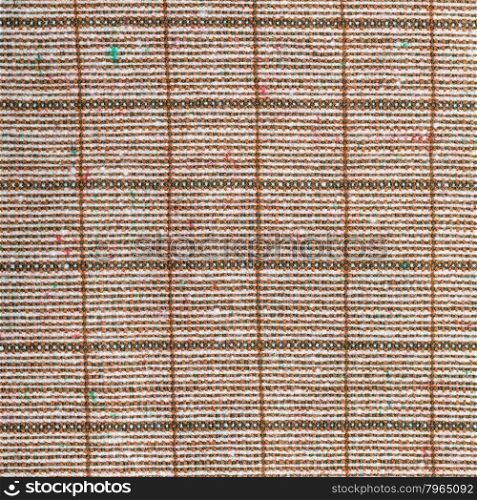square background from checkered brown woolen fabric close up