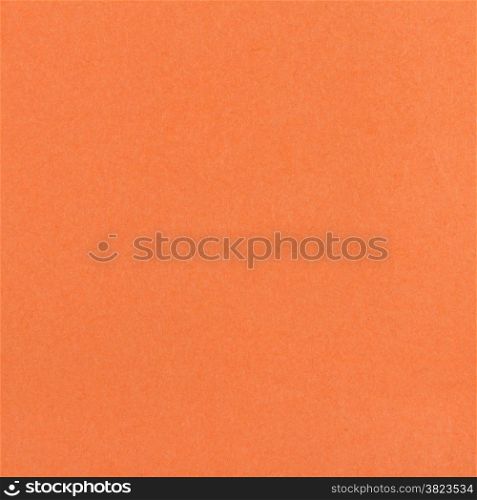 square background from sheet of dark orange color fiber paper close up