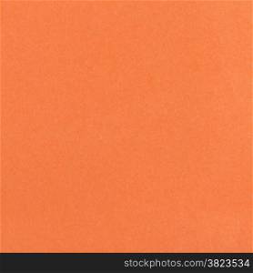 square background from sheet of dark orange color fiber paper close up