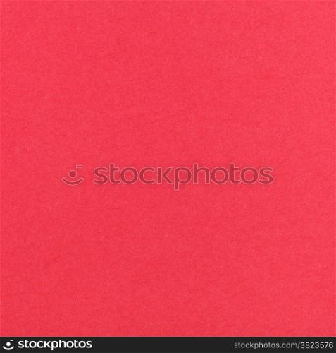 square background from sheet of red pastel paper close up