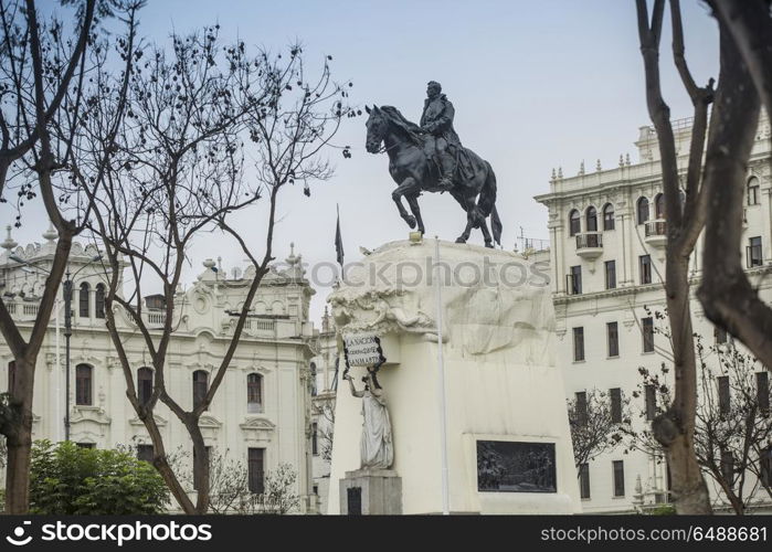 square in the center of which stands a monument to a man on a horse. Lima, Peru.. Lima, Peru.