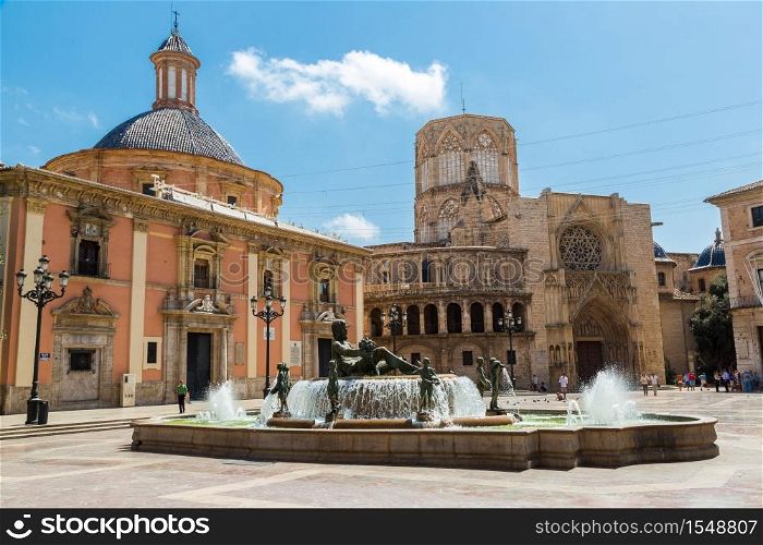 Square of Saint Mary&rsquo;s and fountain Rio Turia in Valencia in a summer day, Spain