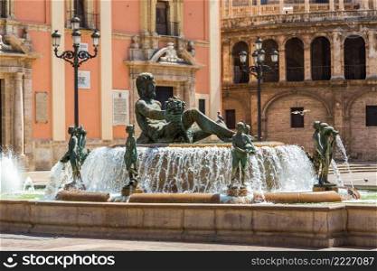 Square of Saint Mary’s and fountain Rio Turia  in Valencia in a summer day, Spain