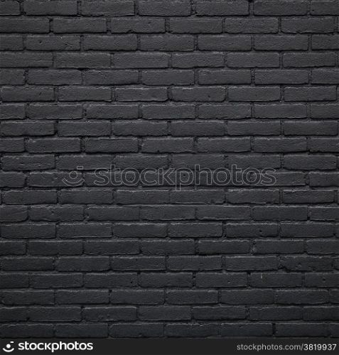 square part of black painted brick wall