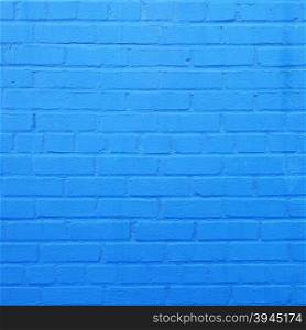 square part of bright sky blue painted brick wall