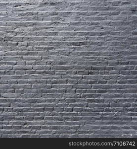 square part of silver gray painted brick wall