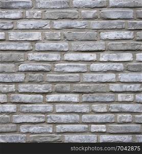 square part of wall consisting of grey silver bricks
