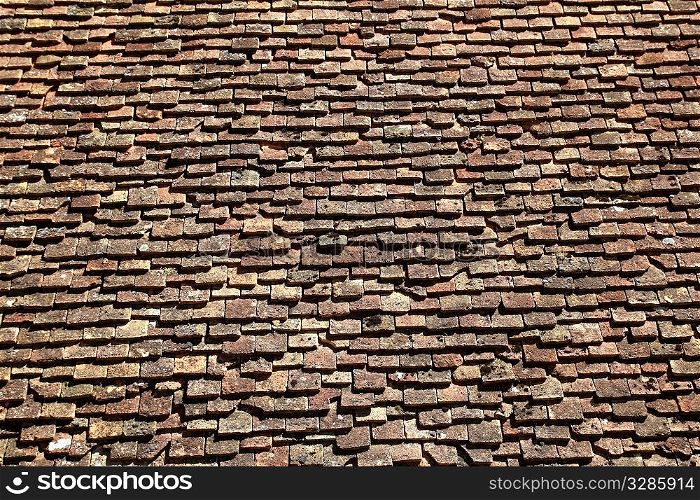 square roof tiles plain clay pattern weathered aged Pyrenees architecture detail