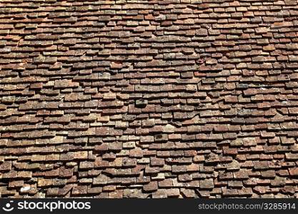square roof tiles plain clay pattern weathered aged Pyrenees architecture detail