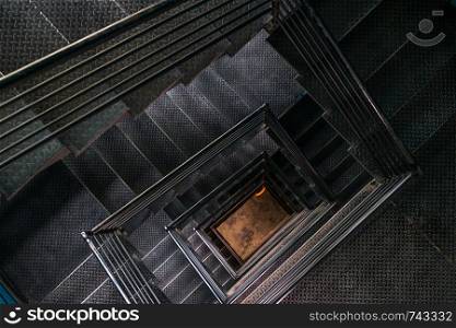 Square steel stairwell view from the top.