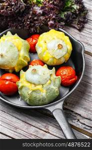 squash in the pan. squash stuffed with cheese and tomatoes in cast iron skillet