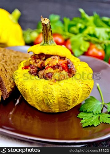 Squash yellow stuffed with meat, tomatoes and peppers, bread in a brown plate, tomatoes, parsley on a dark wooden board