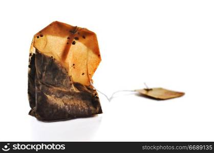 Squeezed tea bag on white background