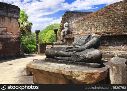 Sri Lanka travel and landmarks - ancient city of Polonnaruwa, UNESCO World Heritage Site. Buddha statue&rsquo; ruins in Vatadage temple. ancient city Polonnaruwa, Sri Lanka&rsquo; temples