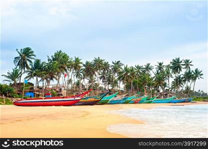 Sri Lankan fisherman boats on the ocean beach