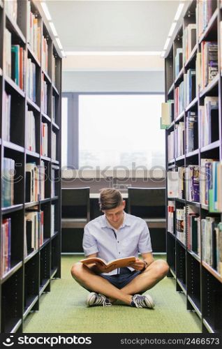 srudent with book sitting floor