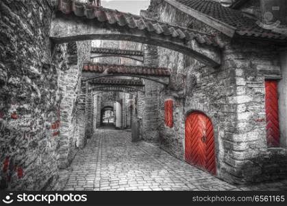 St. Catherine&rsquo;s Passage in Tallinn, Estonia. medieval city in Europe. black and red and white photo