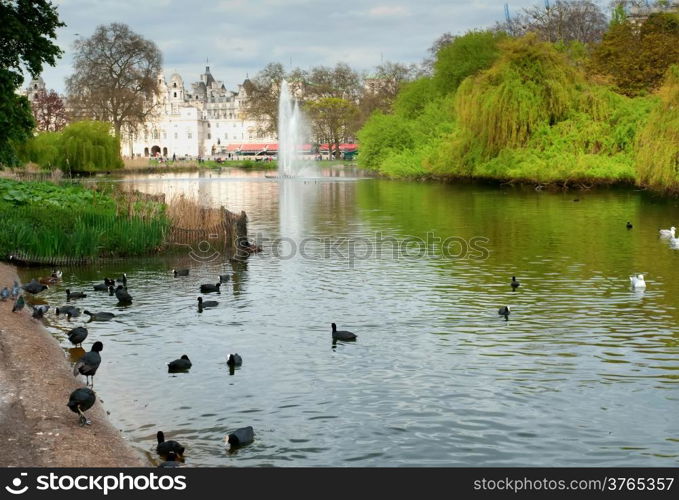 St. James Park lake with Horse Guards and London Eye in the background.