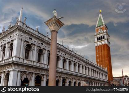St. Marks Campanile on St. Mark&amp;#39;s Square and column with a statue of Saint Theodore after the storm, Venice, Italy